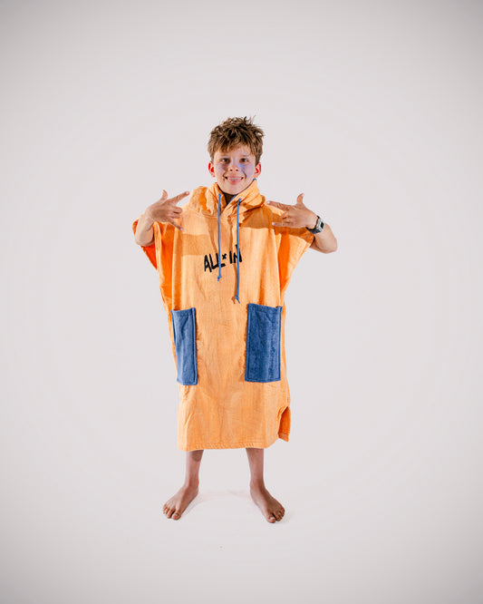Poncho surf enfant ALL-IN Kid Kaï Surf Apricot, vue de face, éponge coton abricot et navy, SS26
